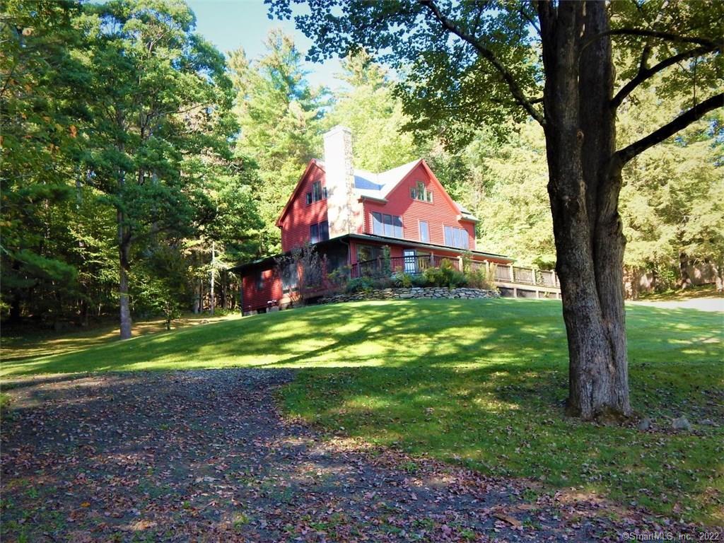 50 River Road Sharon, CT 06754 - Photo 1 of 1 a view of a house with a yard and sitting area