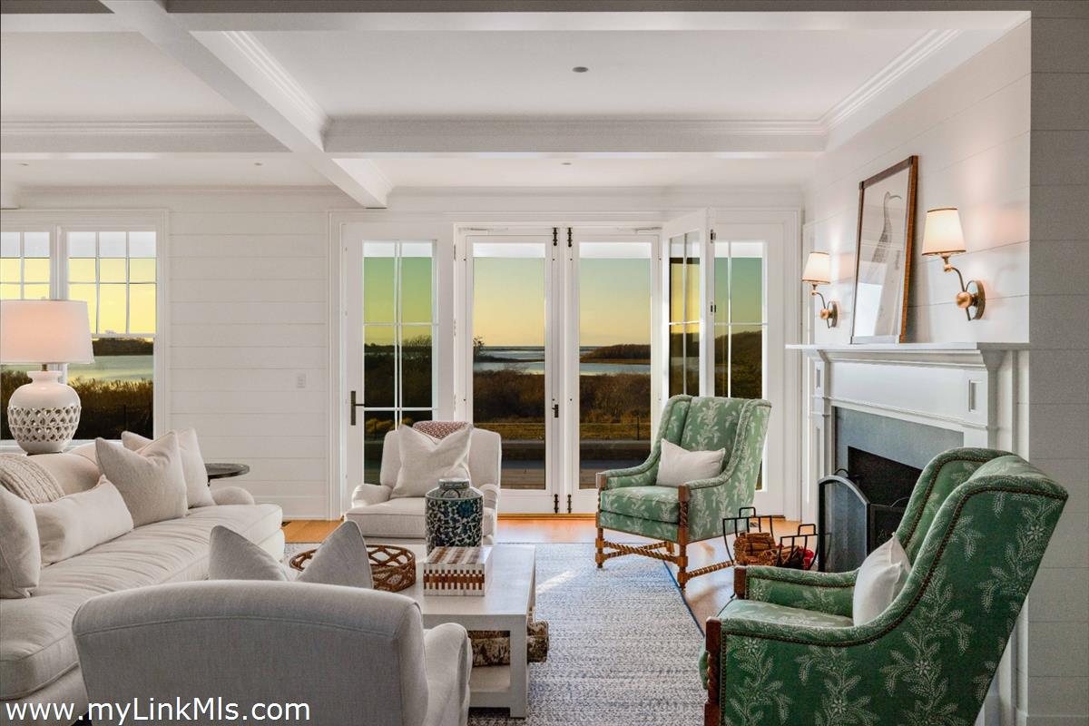 256 Polpis Road Nantucket, MA 02554 - Photo 3 of 30 a living room with furniture large window and fireplace