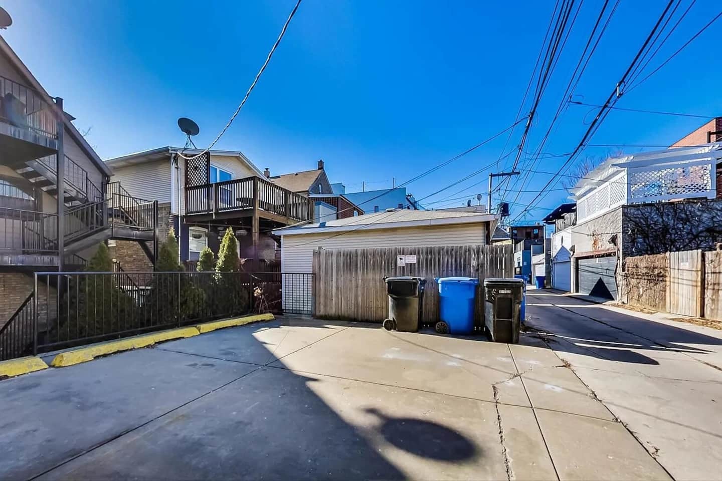 1730 West Beach Avenue, Unit 1 Chicago, IL 60622 - Photo 16 of 16 a view of a house with a barbeque and wooden fence