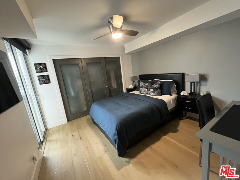 723 Palisades Beach Road, Unit 211 Santa Monica, CA 90402 - Photo 16 of 30 a bedroom with a bed and a walk in closet