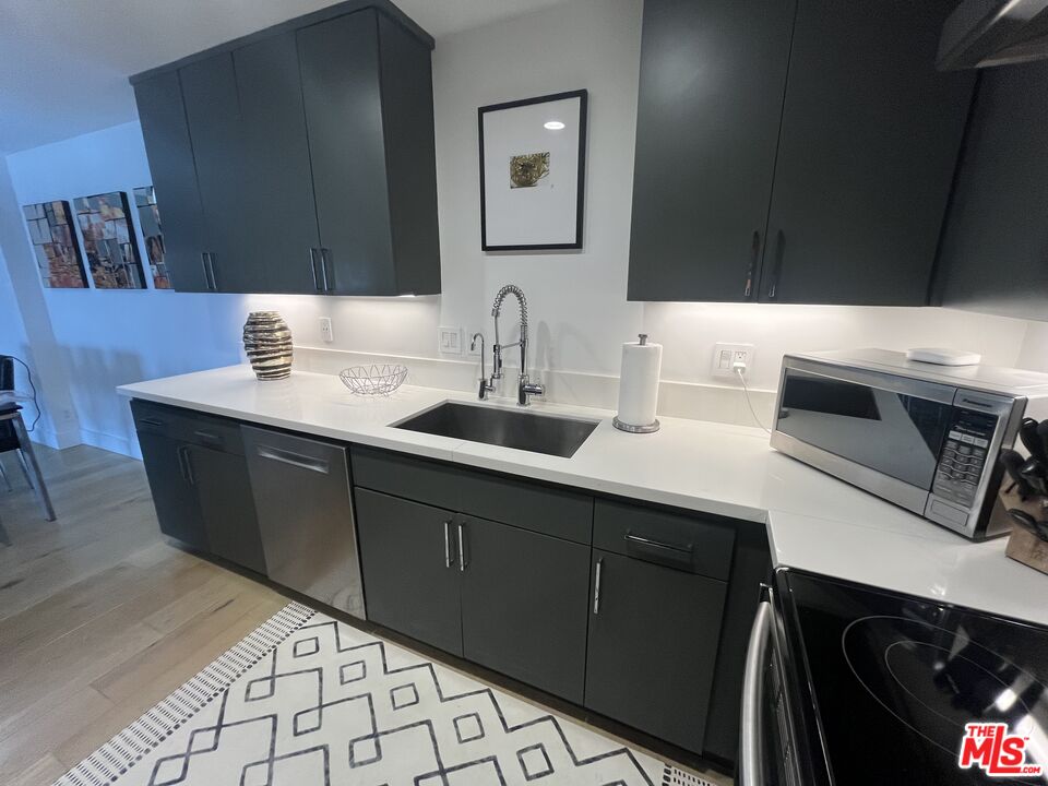 723 Palisades Beach Road, Unit 211 Santa Monica, CA 90402 - Photo 6 of 30 a bathroom with a sink and a mirror