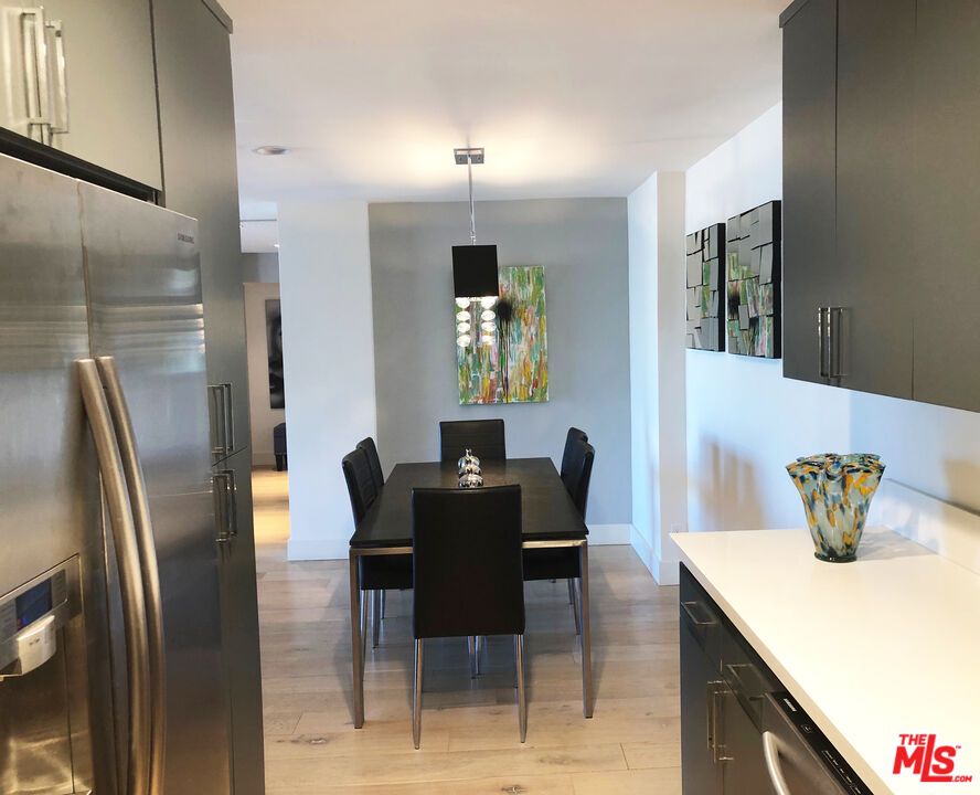 723 Palisades Beach Road, Unit 211 Santa Monica, CA 90402 - Photo 8 of 30 a dining room with furniture and window