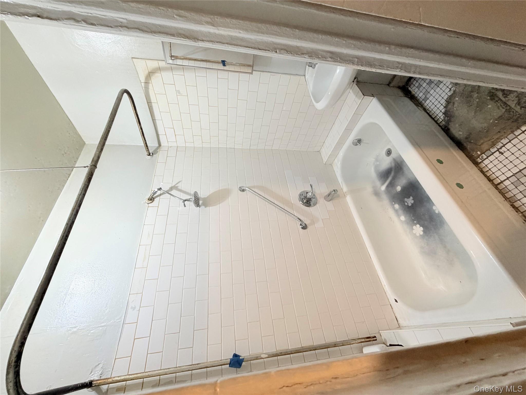 501 West 156th Street, Unit 22 Manhattan, NY 10032 - Photo 11 of 13 Bathroom with bathtub / shower combination and tile patterned floors
