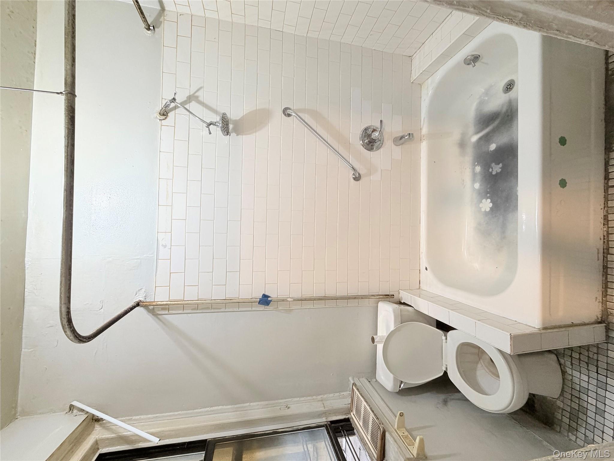 501 West 156th Street, Unit 22 Manhattan, NY 10032 - Photo 12 of 13 Full bathroom with tub / shower combination and tile patterned floors