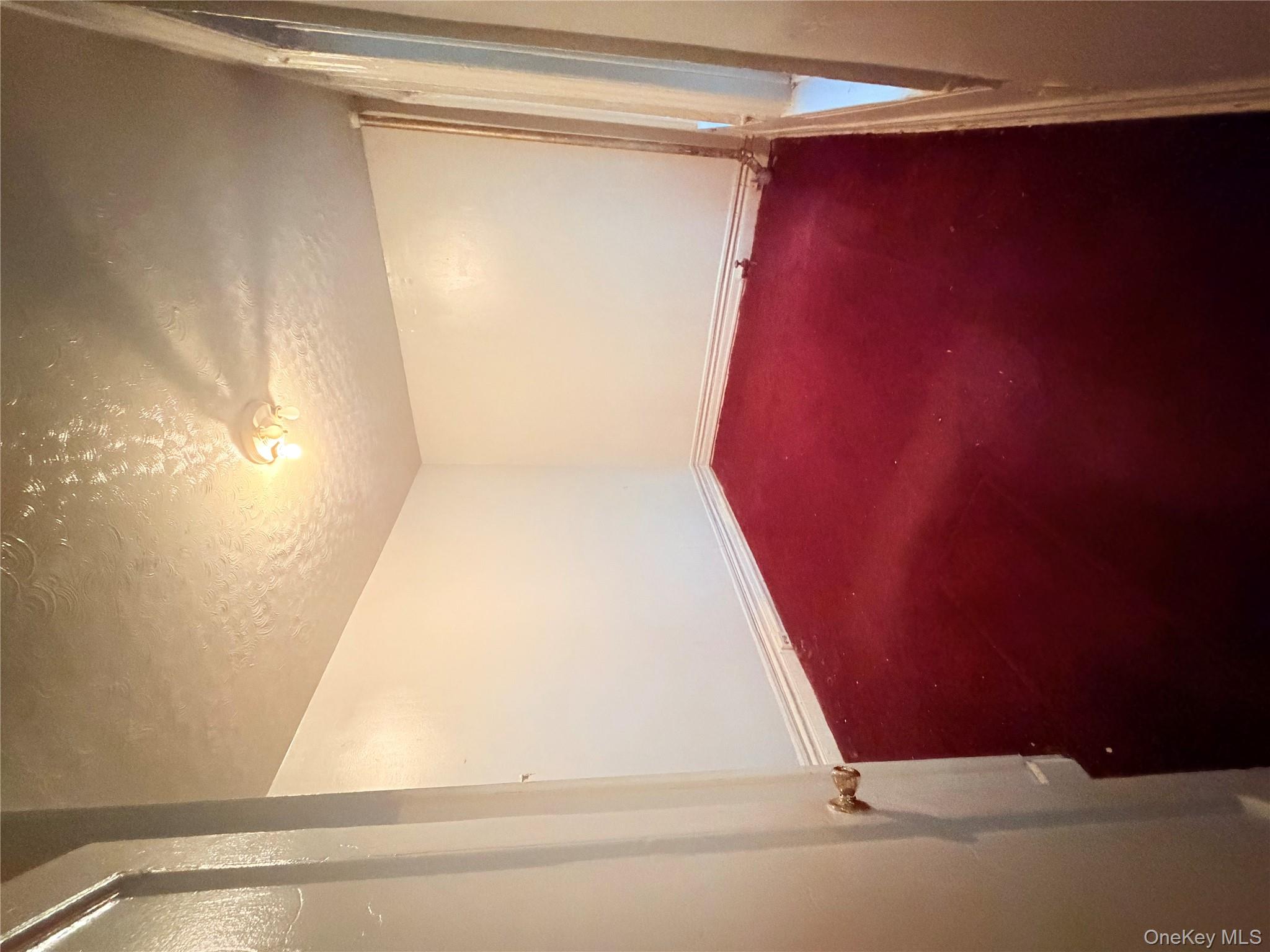 501 West 156th Street, Unit 22 Manhattan, NY 10032 - Photo 4 of 13 Spare room with a textured ceiling and baseboards