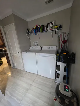 a utility room with dryer and washer