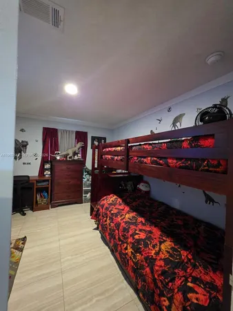 a bed room with furniture and a rug