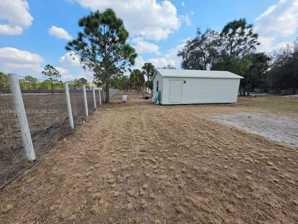 a house view with a backyard space