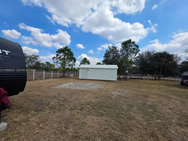 a view of backyard and entertaining space