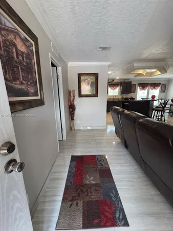 a living room with furniture and a rug