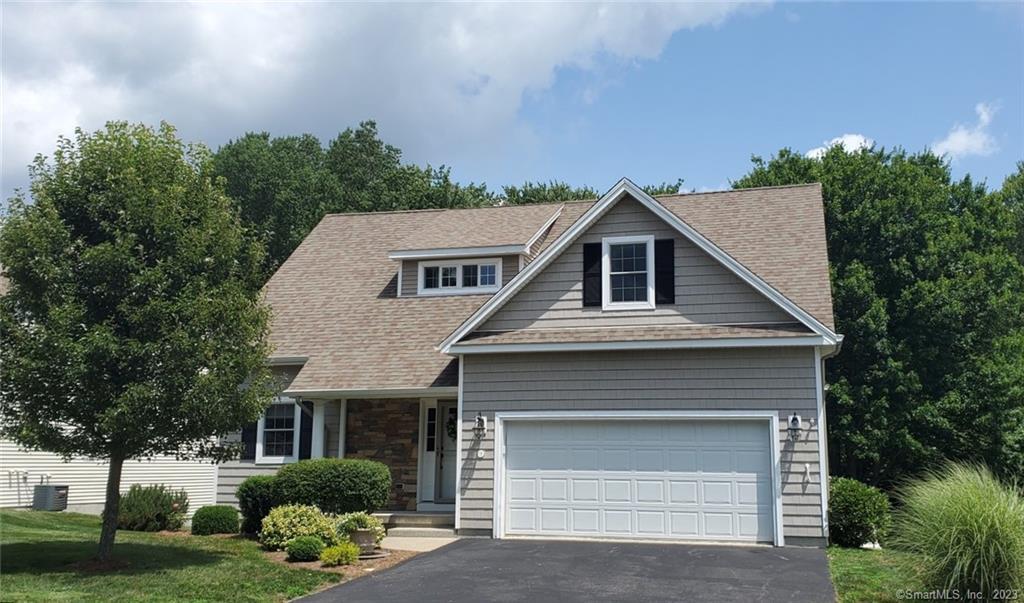 18 Alpine Drive Colchester, CT 06415 - Photo 1 of 1 a front view of a house with a yard and garage