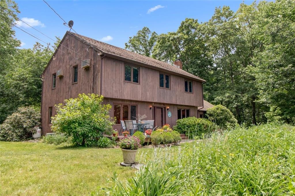 54 Straits Road Chester, CT 06412 - Photo 1 of 1 a front view of house with yard and trees around