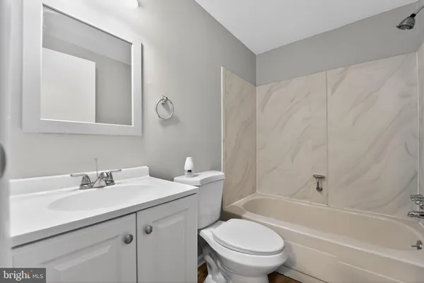 a bathroom with a sink a toilet and a bathtub