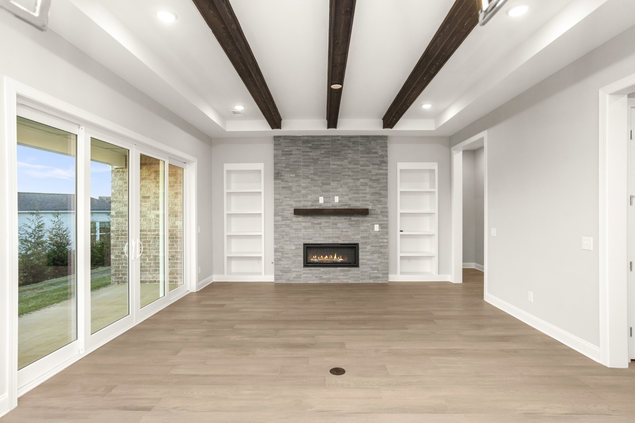 1933 Harmony Road Spring Hill, TN 37174 - Photo 17 of 50 a view of an empty room with a fireplace and a window