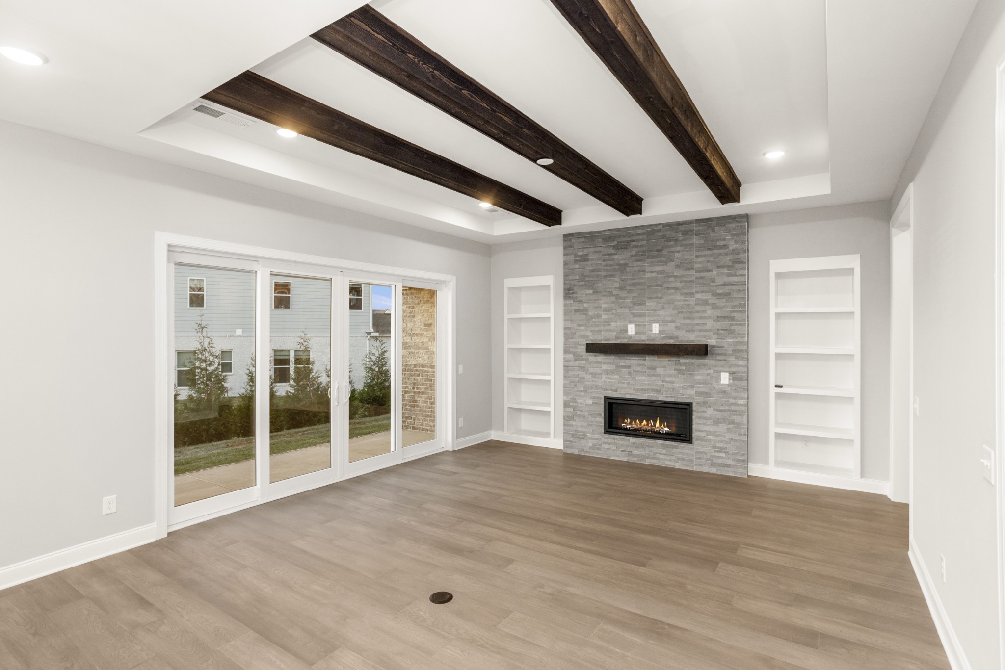 1933 Harmony Road Spring Hill, TN 37174 - Photo 19 of 50 wooden floor fireplace and windows in a room