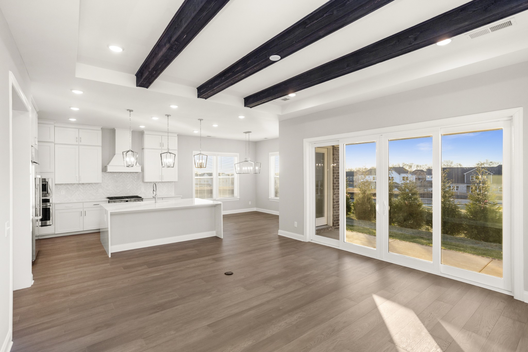 1933 Harmony Road Spring Hill, TN 37174 - Photo 20 of 50 a large kitchen with stainless steel appliances kitchen island granite countertop a large cabinets a sink and a stove