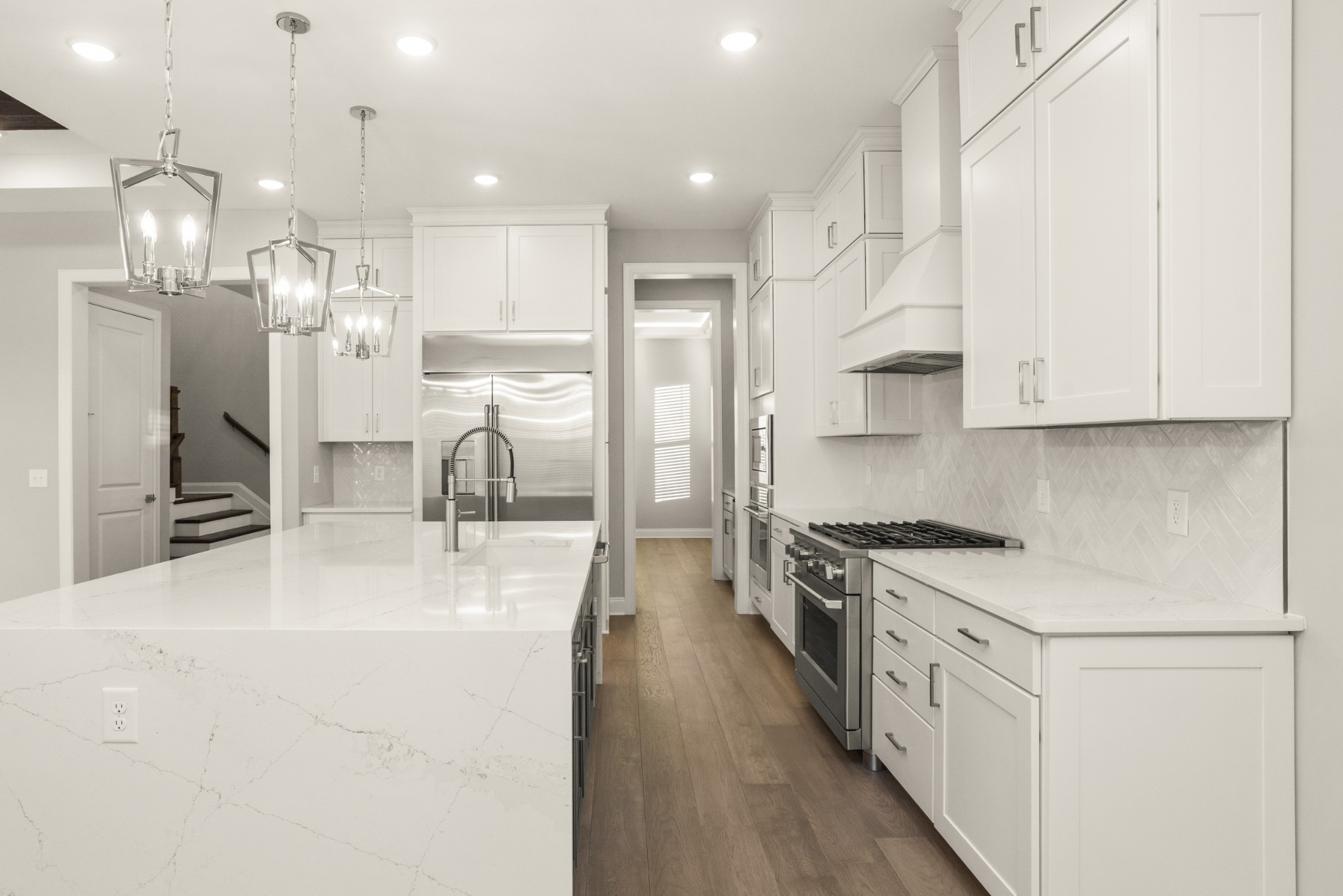 1933 Harmony Road Spring Hill, TN 37174 - Photo 22 of 50 a kitchen with stainless steel appliances granite countertop a lot of cabinets and wooden floor