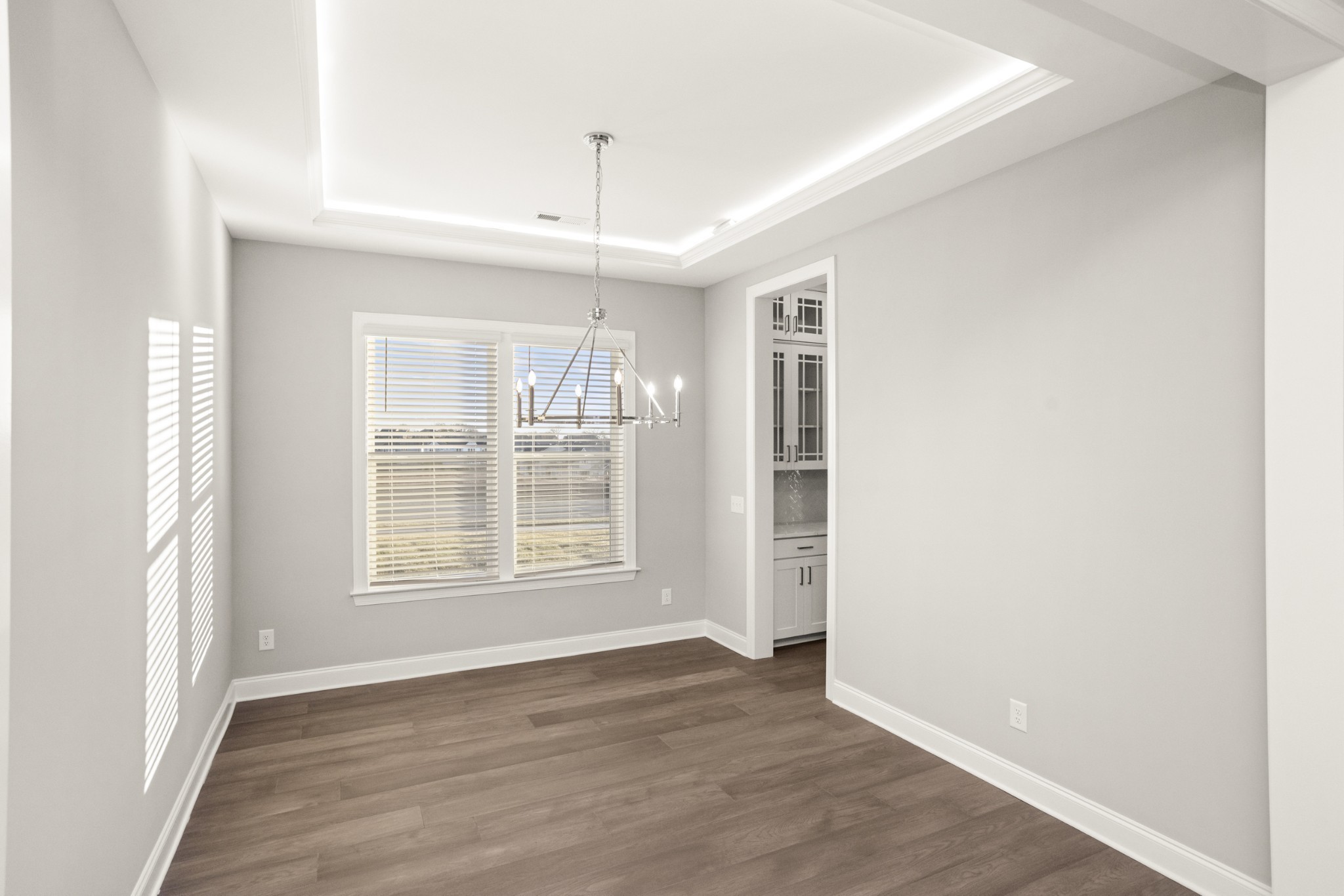 1933 Harmony Road Spring Hill, TN 37174 - Photo 8 of 50 an empty room with wooden floor and windows