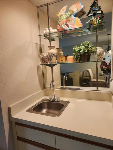 a view of a sink a counter top space