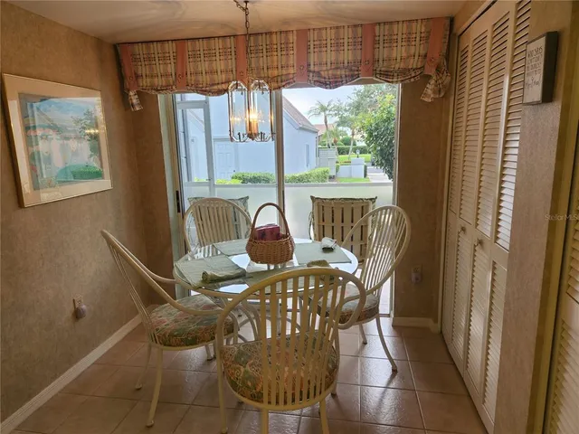a view of a dining room with furniture window and outside view