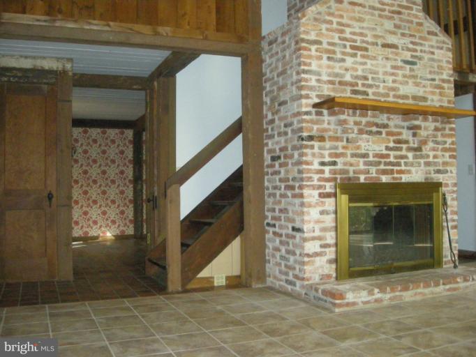 13101 Dover Road Reisterstown, MD 21136 - Photo 21 of 23 Family Room and Dining Room/stairs to left