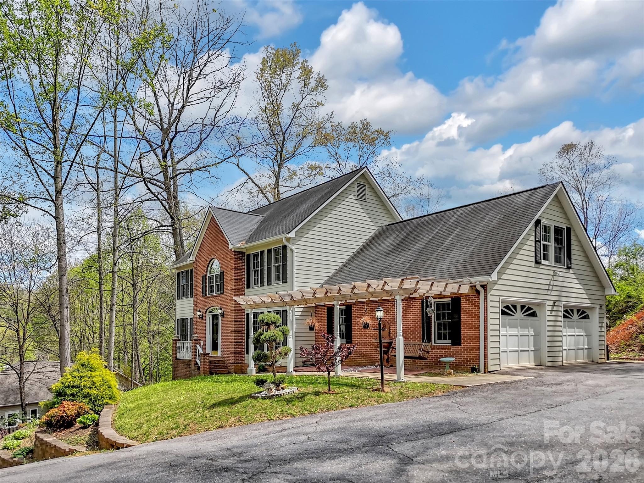 29 Tillman Road Lake Junaluska, NC 28745 - Photo 42 of 46 a front view of a house with garden