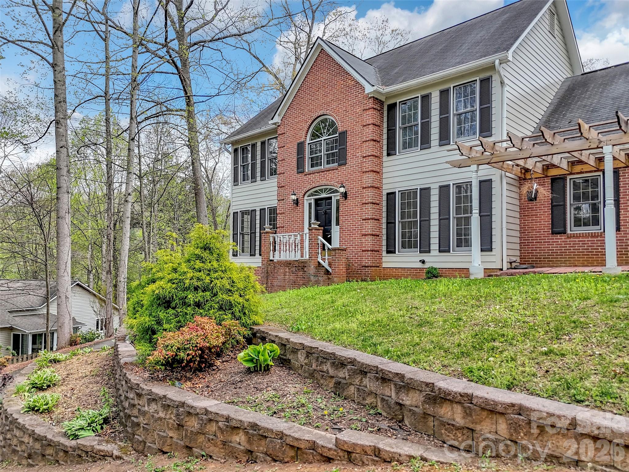 29 Tillman Road Lake Junaluska, NC 28745 - Photo 43 of 46 a front view of a house with a garden