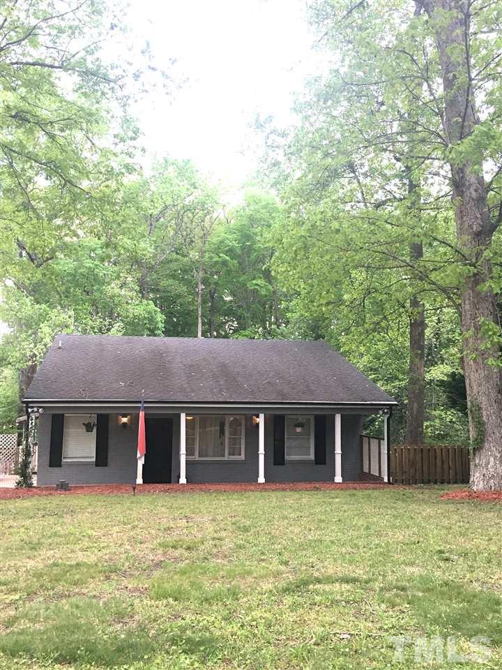 512 Rose Lane Raleigh, NC 27610 - Photo 1 of 22 a front view of a house with a garden