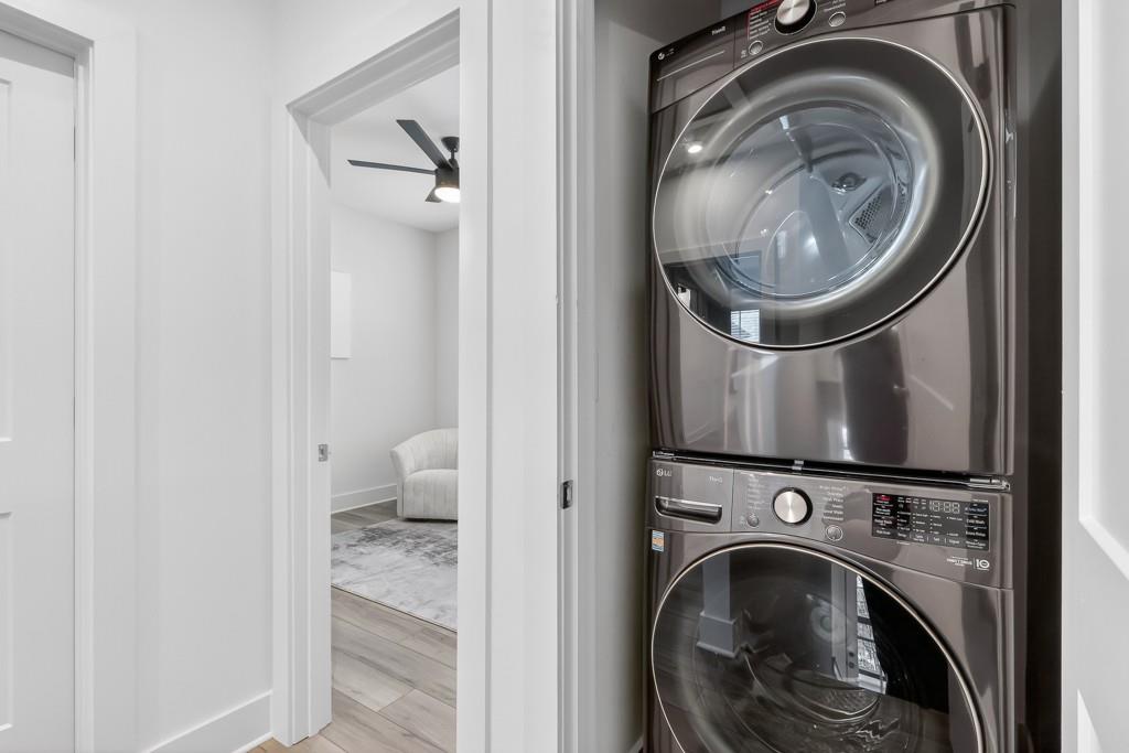 4455 Dandelion Lane Atlanta, GA 30342 - Photo 23 of 44 a view of a hallway with washer and dryer