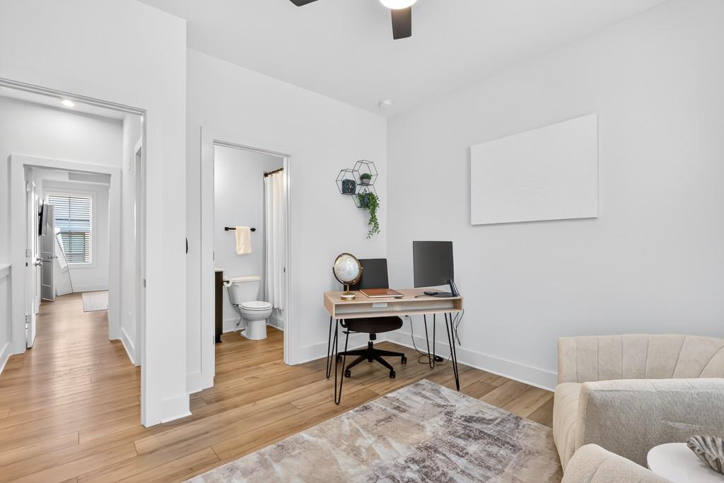 4455 Dandelion Lane Atlanta, GA 30342 - Photo 25 of 44 a workspace with furniture and wooden floor