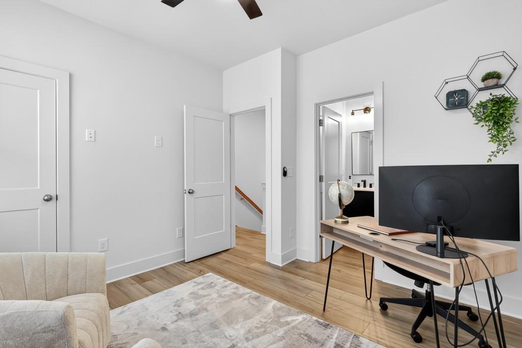 4455 Dandelion Lane Atlanta, GA 30342 - Photo 26 of 44 a view of a workspace with furniture and a gate