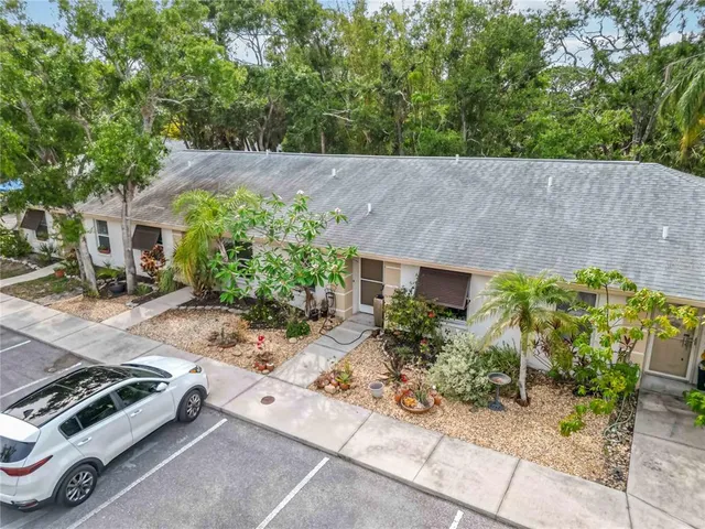 an aerial view of a house with yard