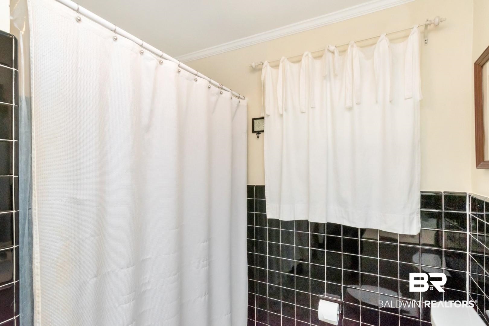 302 Springwood Drive East Mobile, AL 36608 - Photo 27 of 35 Bathroom featuring tile walls and crown molding
