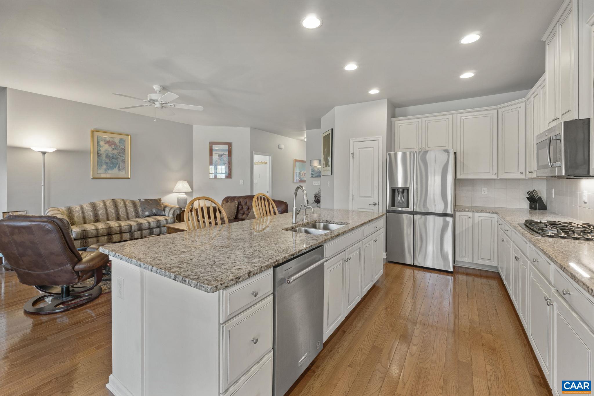 1377 Delphi Lane Charlottesville, VA 22911 - Photo 13 of 48 a large kitchen with kitchen island a large counter space a sink appliances and cabinets
