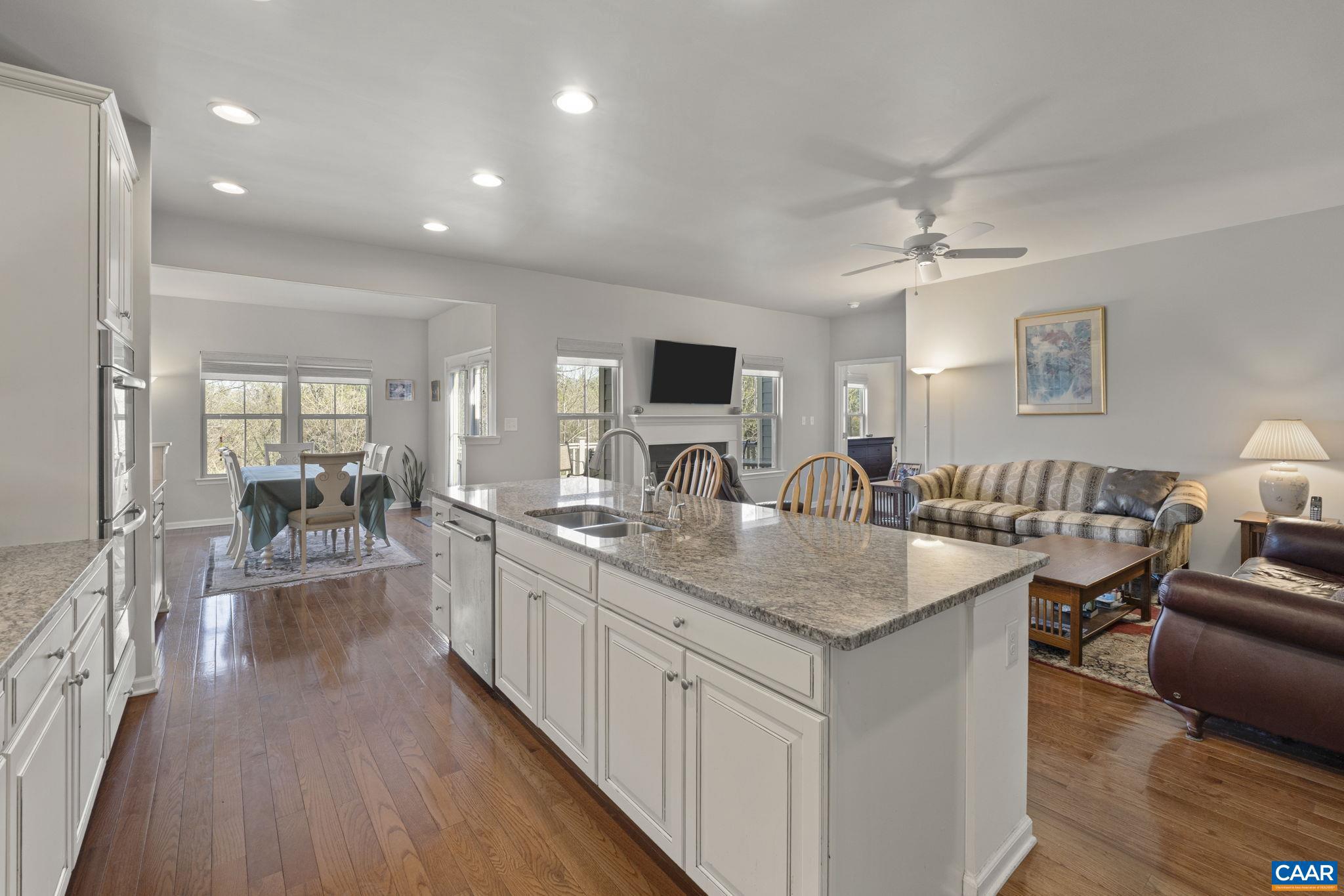 1377 Delphi Lane Charlottesville, VA 22911 - Photo 14 of 48 a view of living room kitchen island dining table and chairs