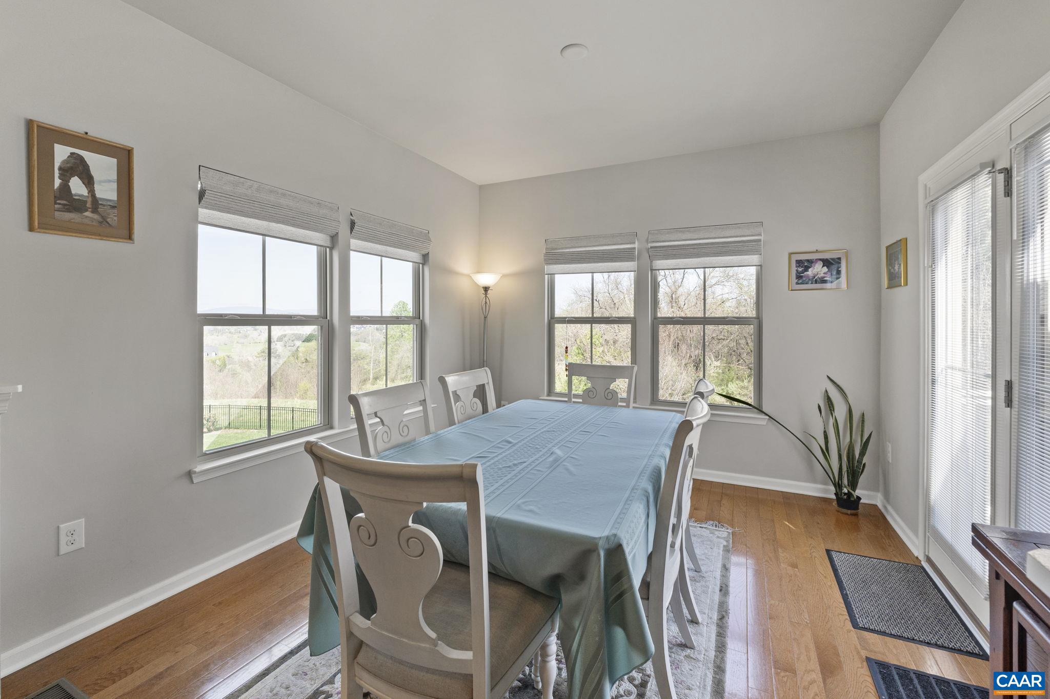 1377 Delphi Lane Charlottesville, VA 22911 - Photo 16 of 48 a view of a dining room with furniture window and outside view