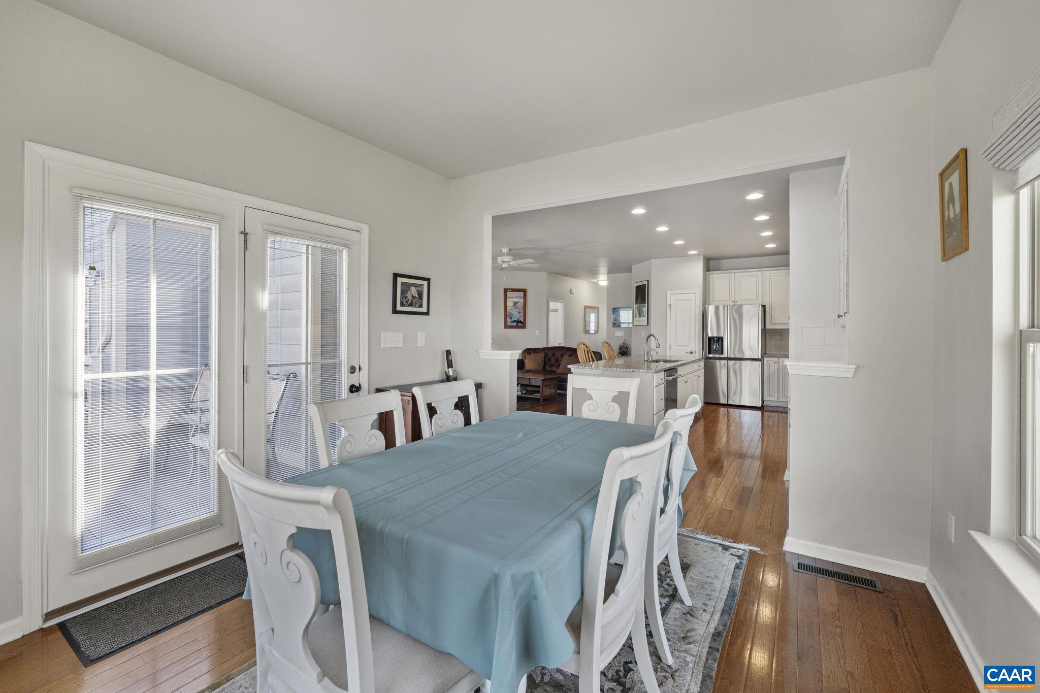 1377 Delphi Lane Charlottesville, VA 22911 - Photo 17 of 48 a view of a dining room with furniture and wooden floor