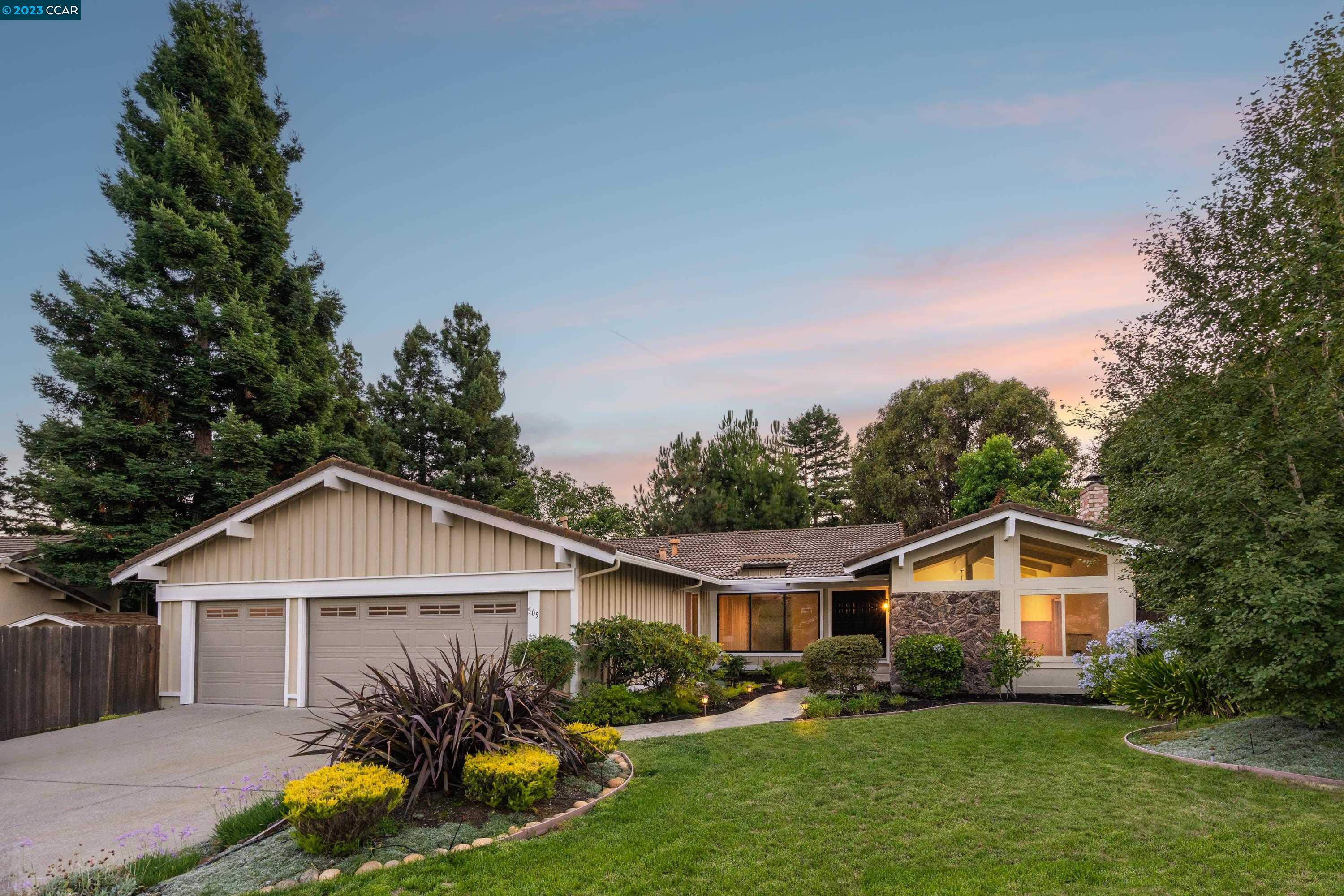 505 Haiti Court San Ramon, CA 94582 - Photo 1 of 1 a view of a yard in front of a house with plants and large tree