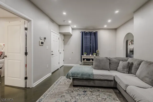 a living room with furniture and a rug
