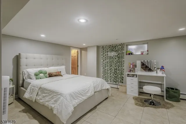 a bedroom with a bed and a desk