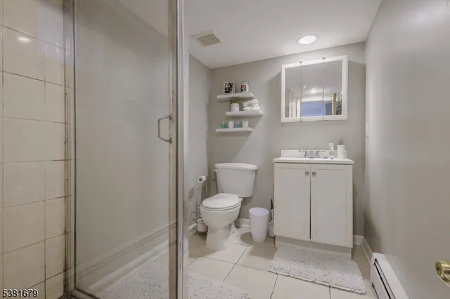 a bathroom with a toilet sink and vanity