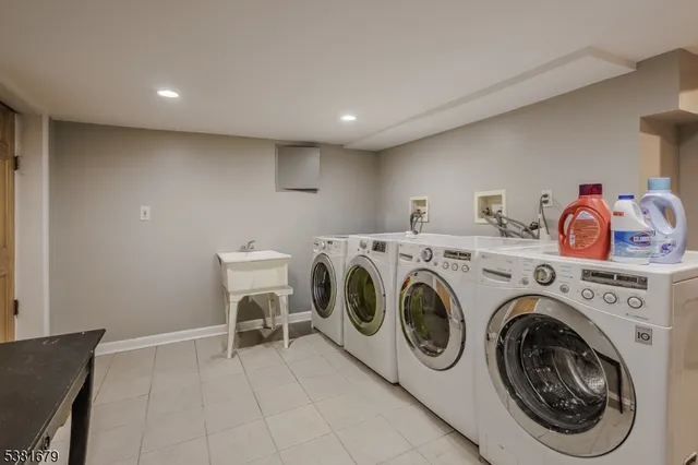 a view of washer and dryer with kitchen in the background
