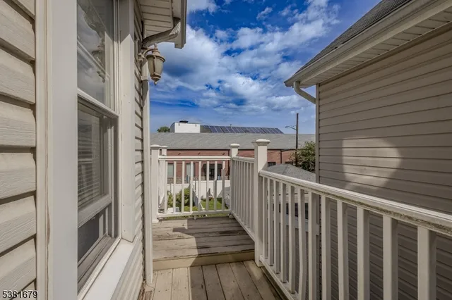 a bathroom with a sink a mirror and a shower curtain