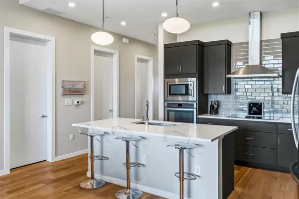 a living room with furniture tv and a flat screen tv
