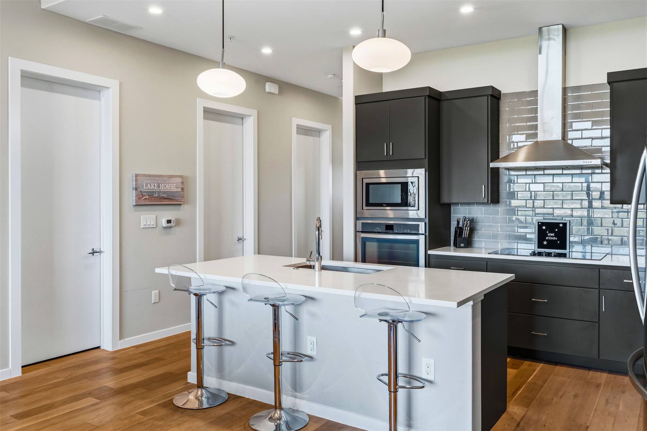 5921 Hiline Road, Unit 2304 Austin, TX 78734 - Photo 12 of 39 a kitchen with stainless steel appliances granite countertop a sink refrigerator and cabinets