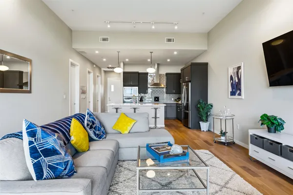 a bedroom with a bed and flat screen tv