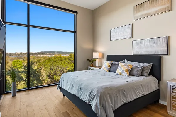 a bed room with a bed and a lamp