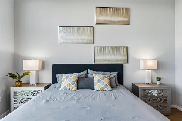 a bathroom with a granite countertop sink a toilet and shower
