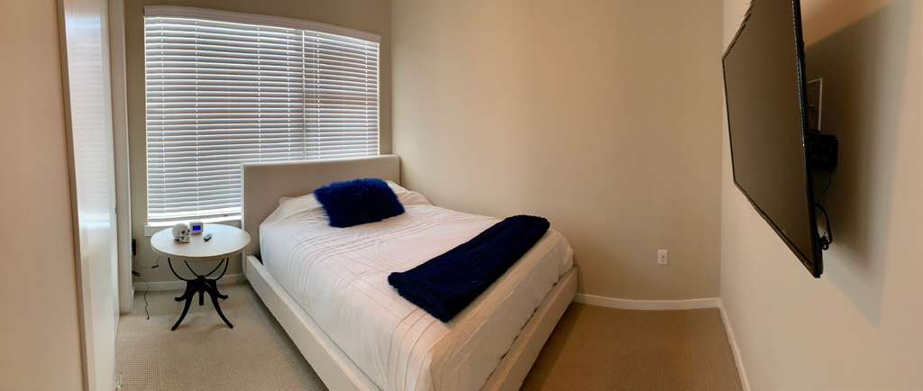 5921 Hiline Road, Unit 2304 Austin, TX 78734 - Photo 6 of 39 a bedroom with a bed and a chair