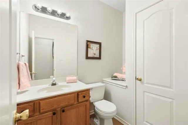 a spacious bathroom with a granite countertop sink mirror and a